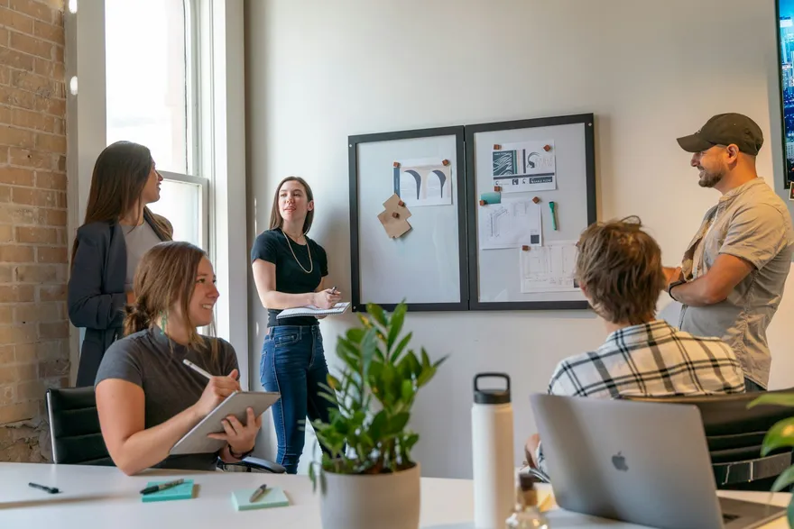 Professional team collaborating in a bright, sunlit office