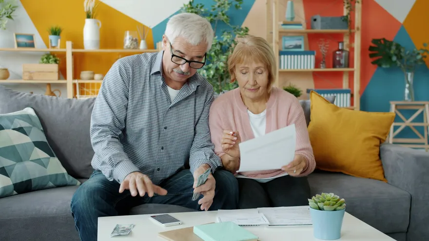 Senior couple reviewing a Medicare document together at home
