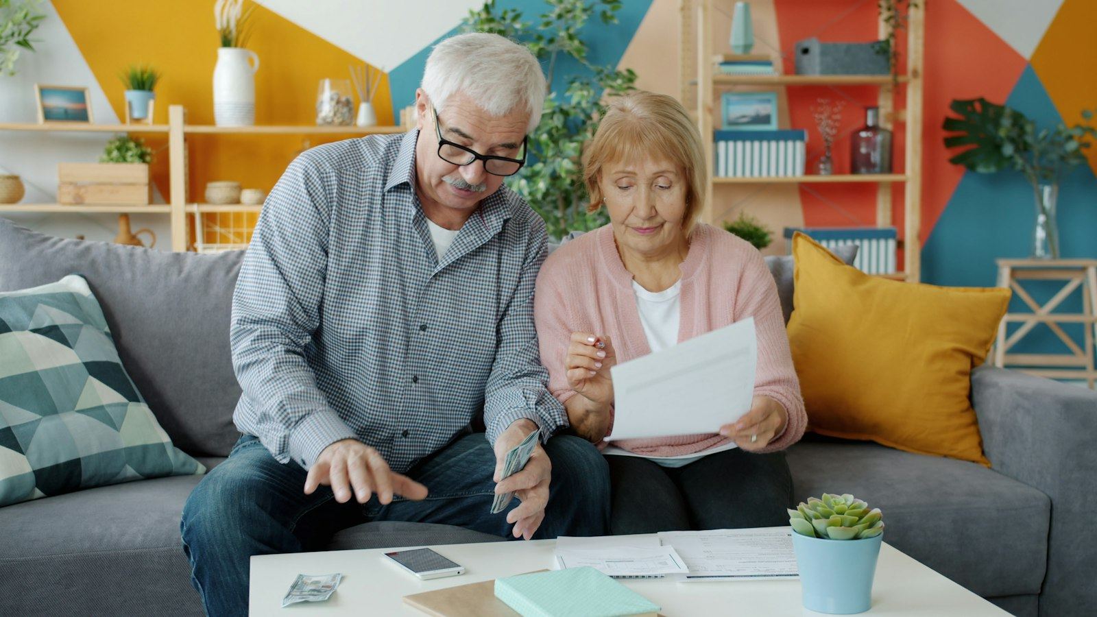 Senior couple reviewing a Medicare document together at home